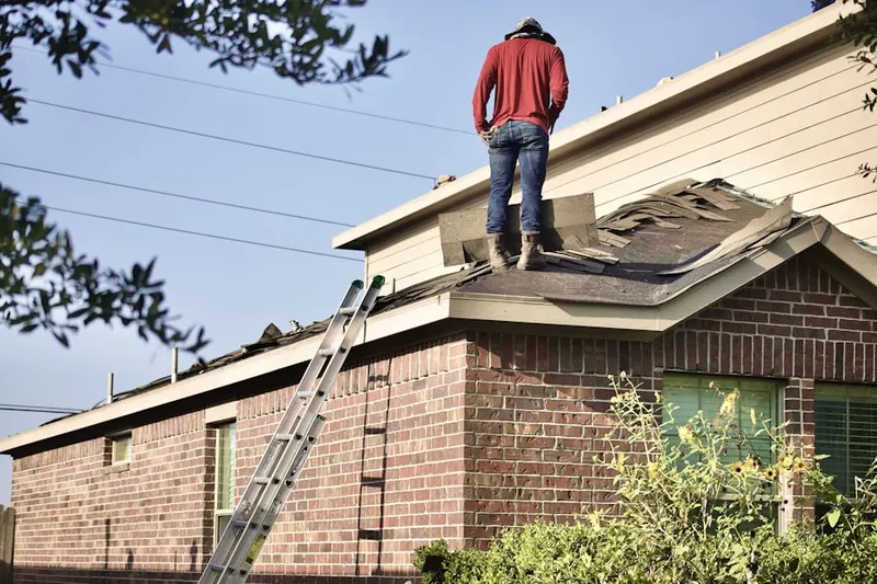 Professional roofer working on a residential roof in Seldersville